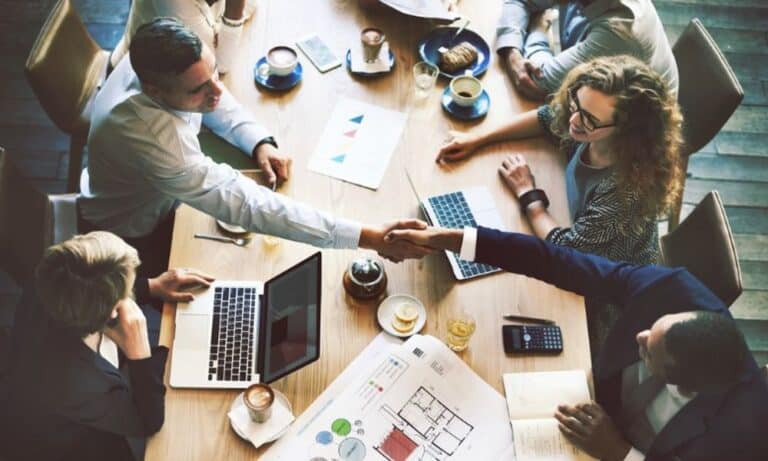 Employees networking after meeting