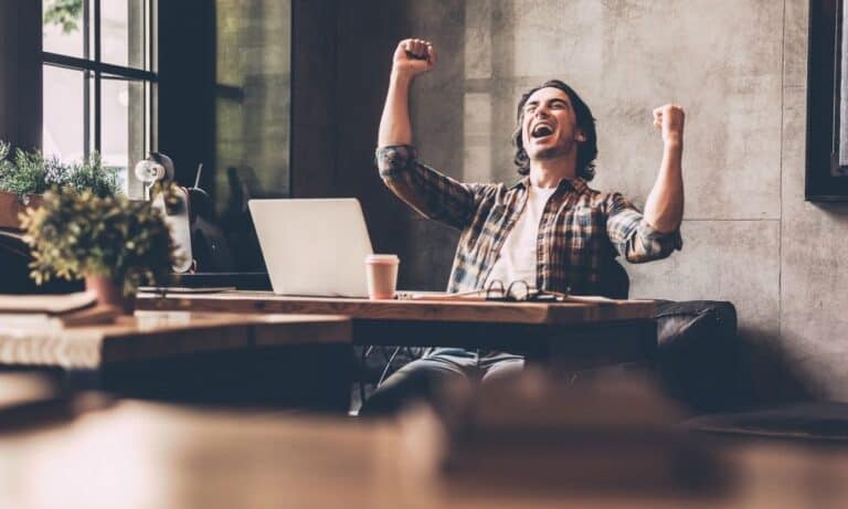 Person excited for good news via email