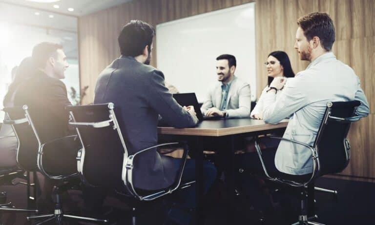 Executives in meeting around conference table