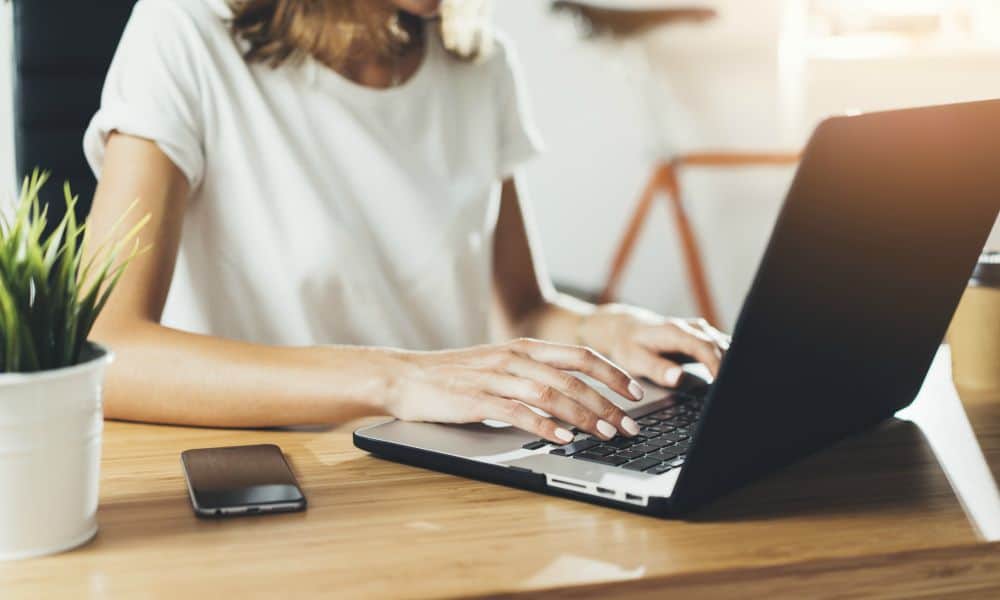 Woman job hunting on her laptop