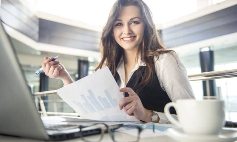 Employee smiling at desk while working
