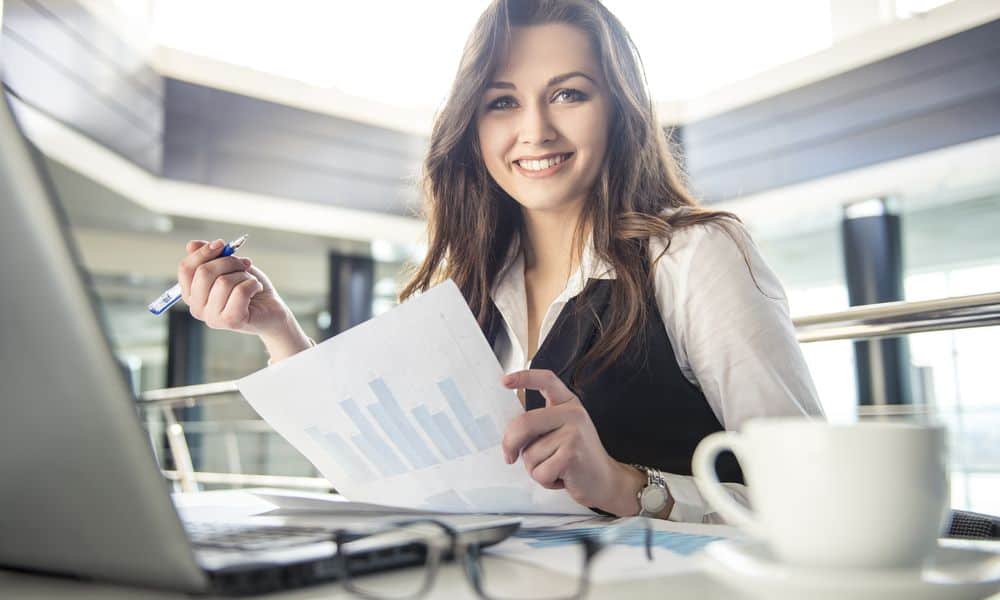 Employee smiling at desk while working