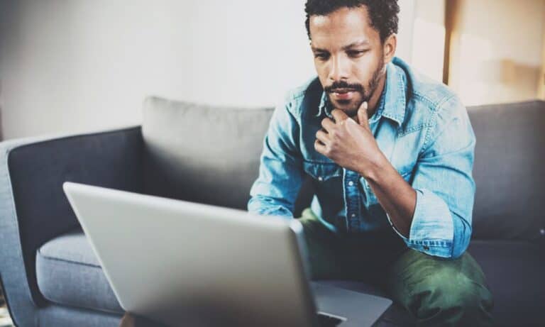 Person searching for jobs on a laptop