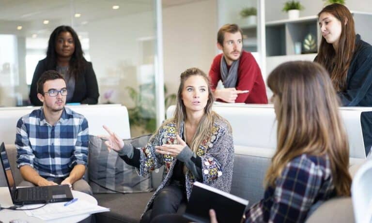Millennials chatting in office