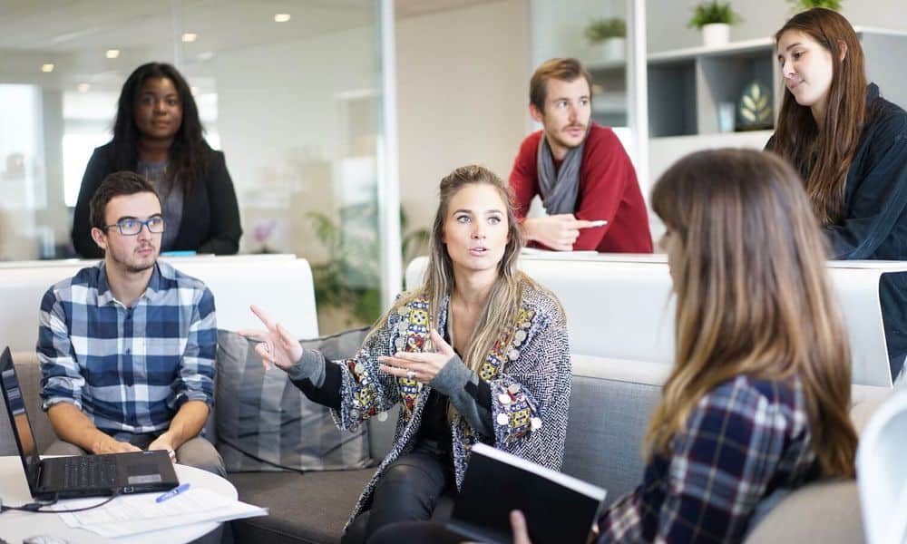 Millennials chatting in office