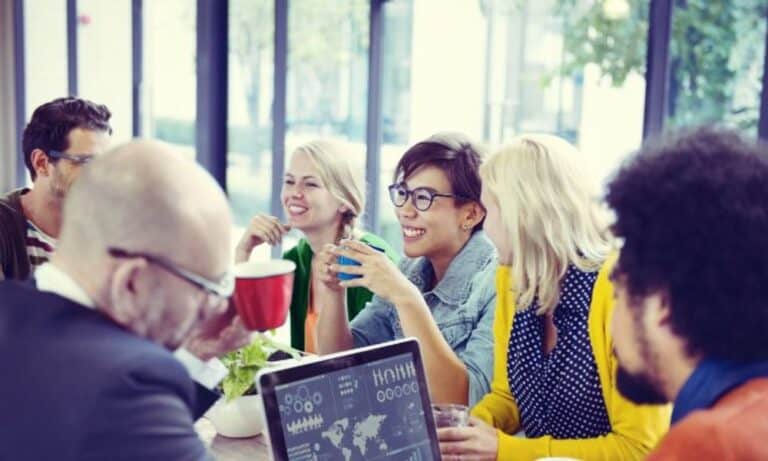 Employees chatting over lunch meeting