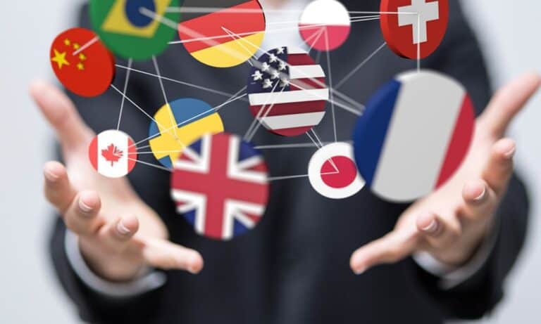 Hands juggling flags from many nations