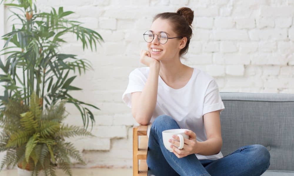 Woman relaxing in chair with a cup of coffee