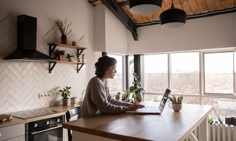 Woman working from home in kitchen