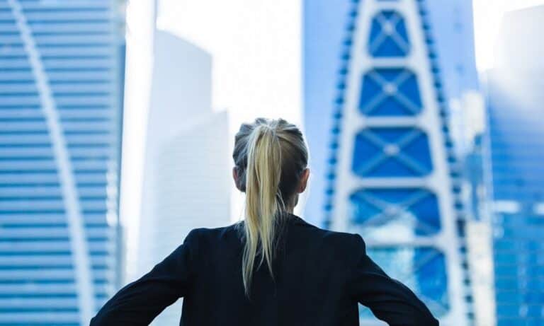 Woman looking out window at work