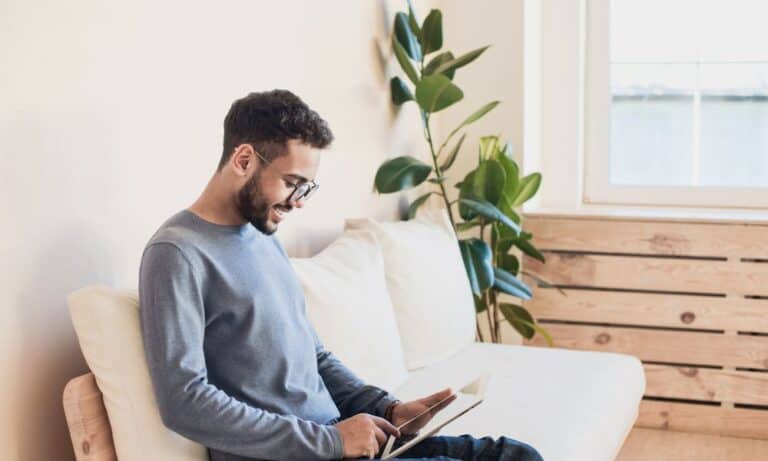 Person sitting on the couch on laptop