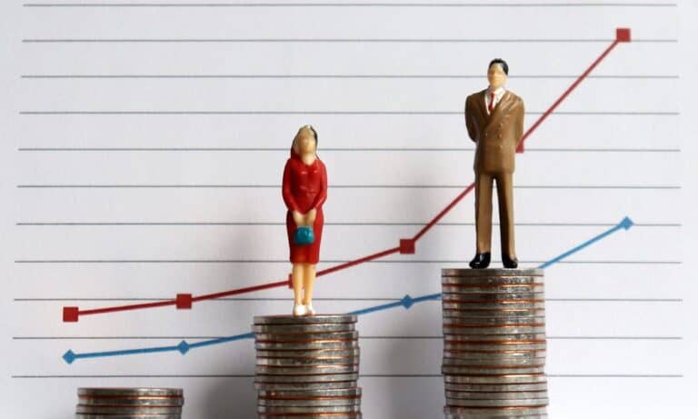 Woman and man standing on coins