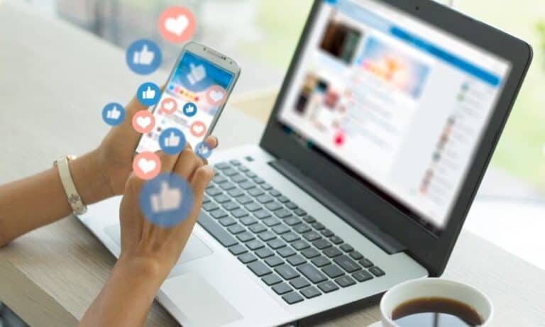 Woman on phone with social media apps open