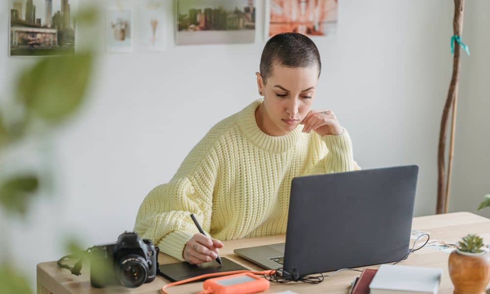 Graphic Designer working from home on her laptop