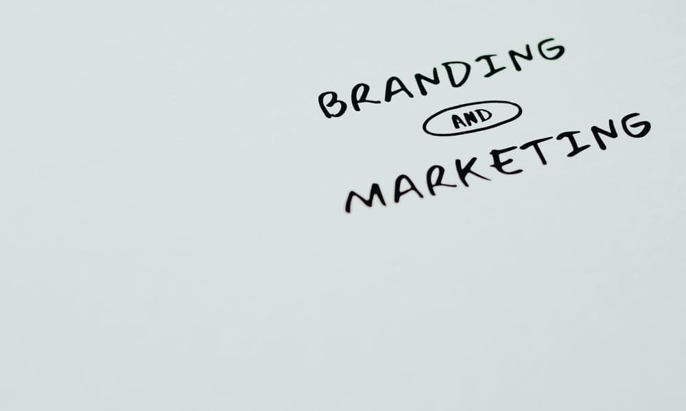 Brand and marketing written on a whiteboard.