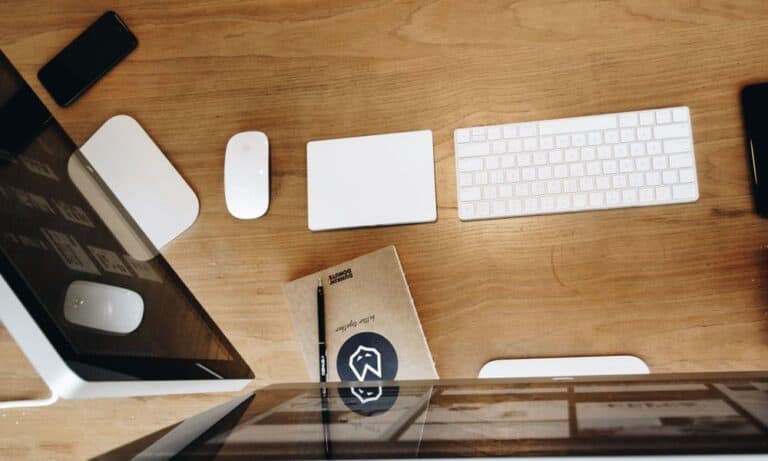 Photo of a desk with a keyboard and mouse.