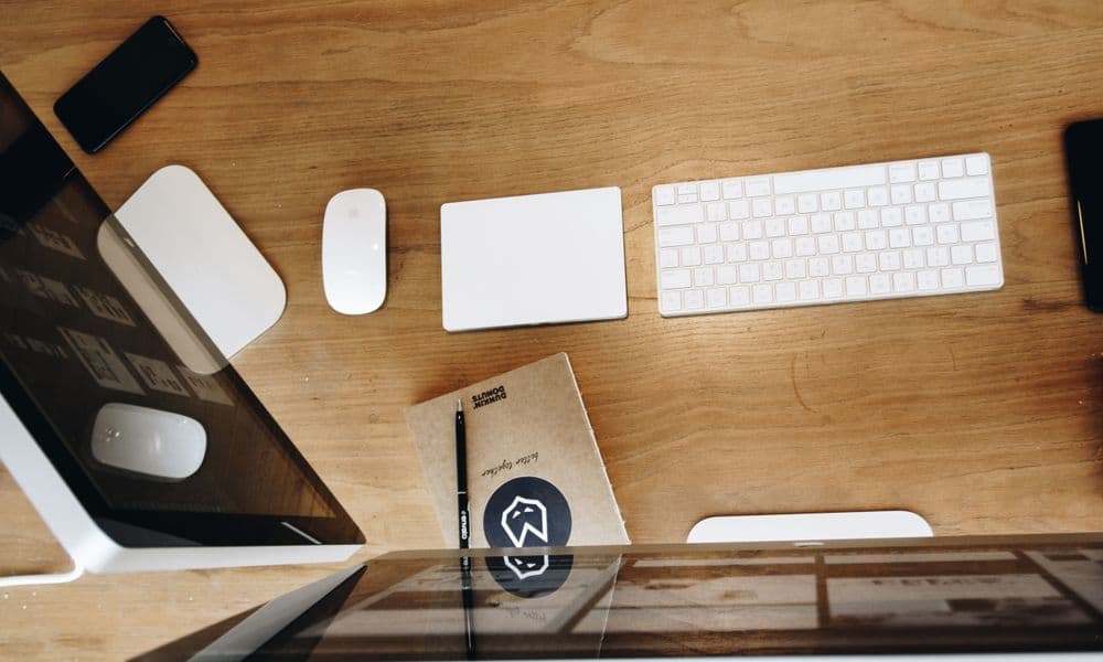 Photo of a desk with a keyboard and mouse.