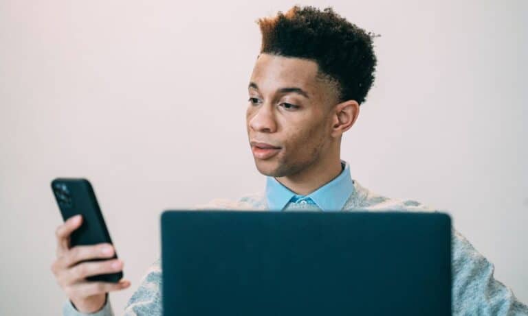 Photo of a Digital Marketing Manager looking at cellphone.