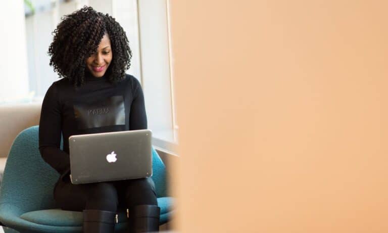 Photo of an email marketing specialist typing at a laptop.