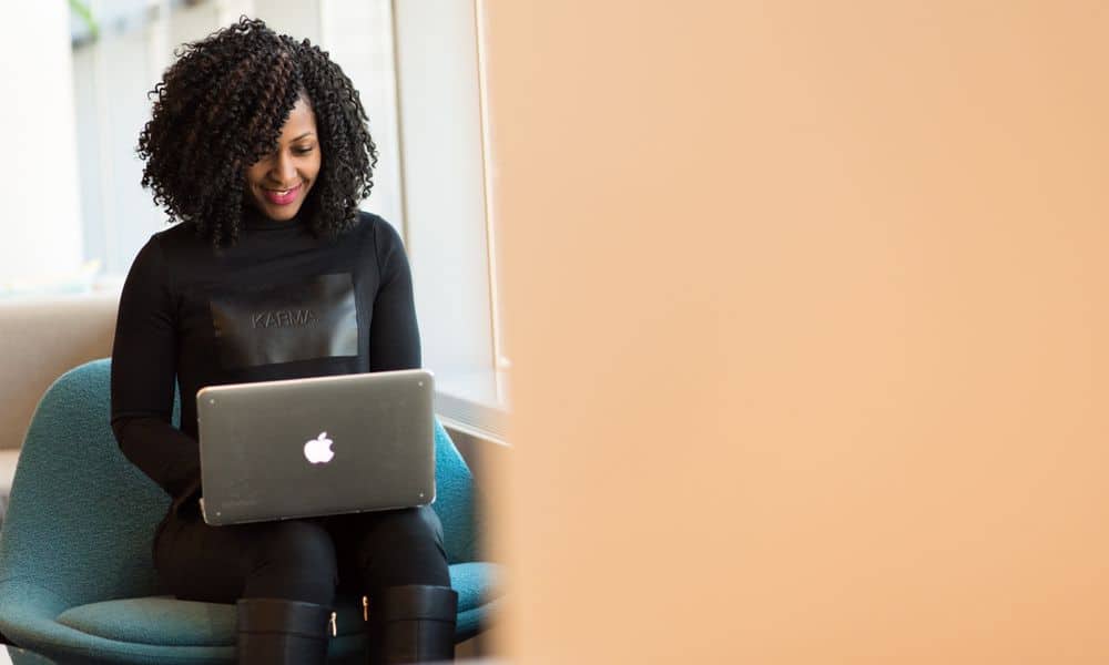 Photo of an email marketing specialist typing at a laptop.