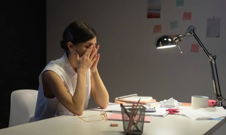 Photo of an employee experiencing burnout.
