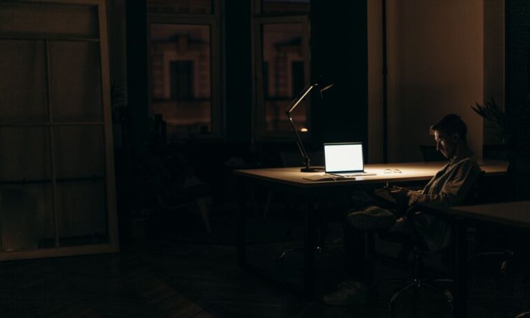Photo of an employee not focused on their work.