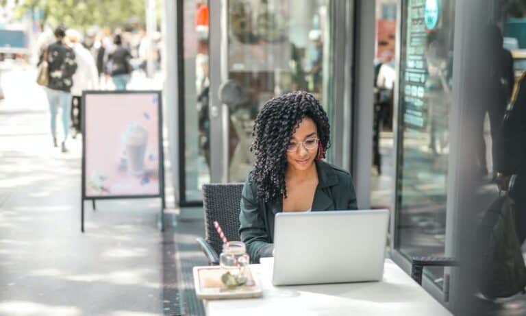 Employee typing at a laptop.
