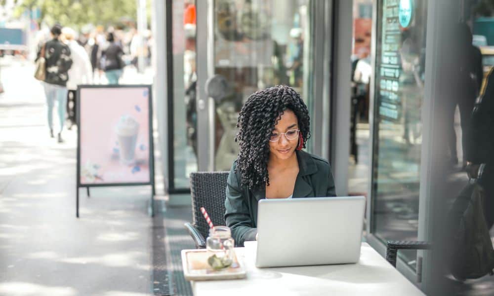 Employee typing at a laptop.