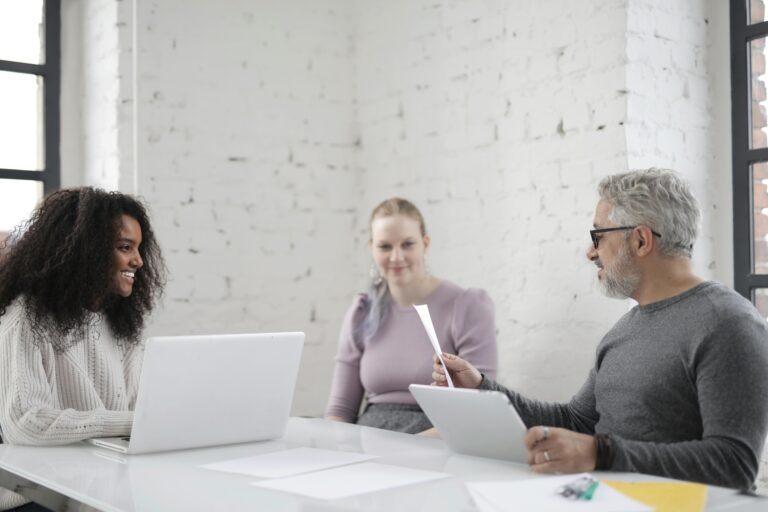 Employees smiling in a meeting.