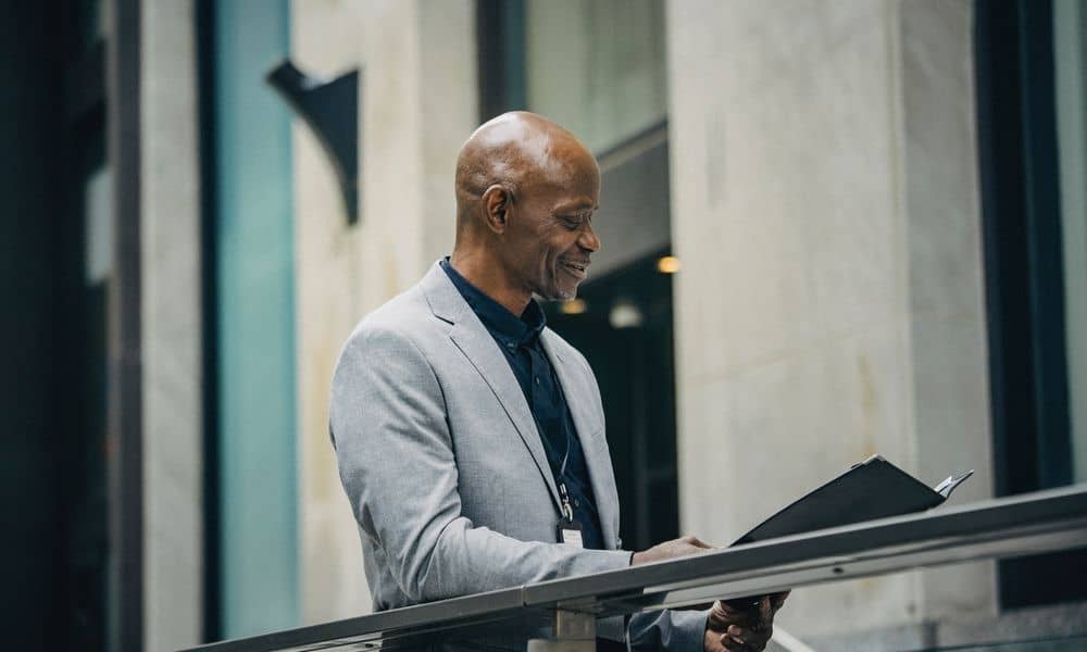 Photo of an employer reading over a resume.