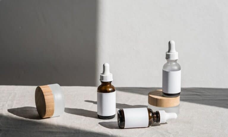 Photo of empty beauty product containers on a table.