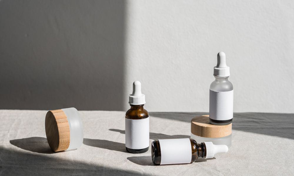Photo of empty beauty product containers on a table.