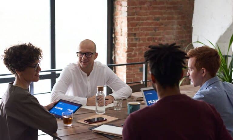 Managers sitting at a table together.