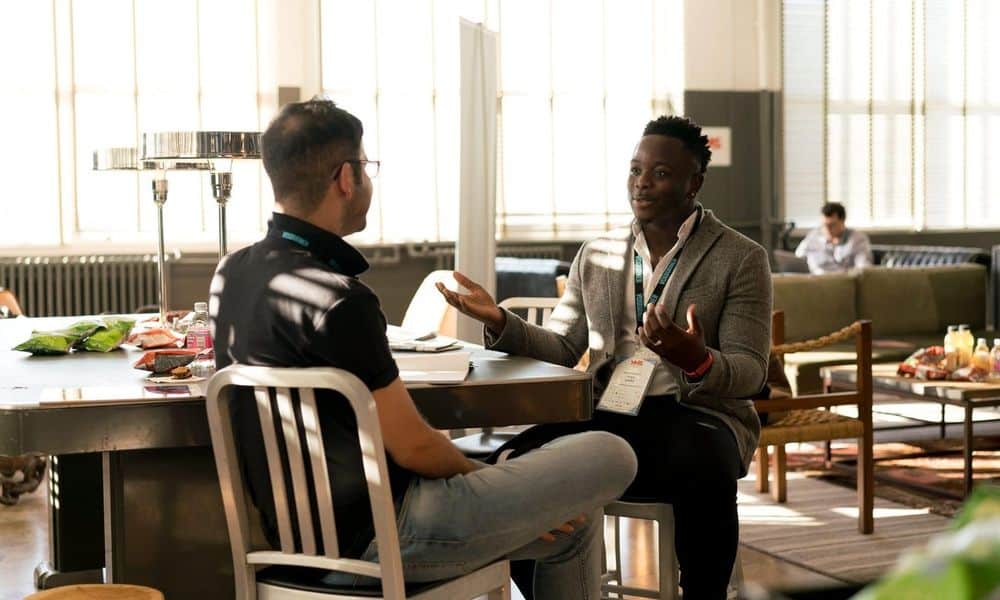 Photo of mentors discussing in a workplace.
