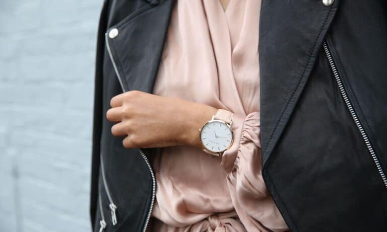 Photo of an outfit with a leather jacket and a watch.