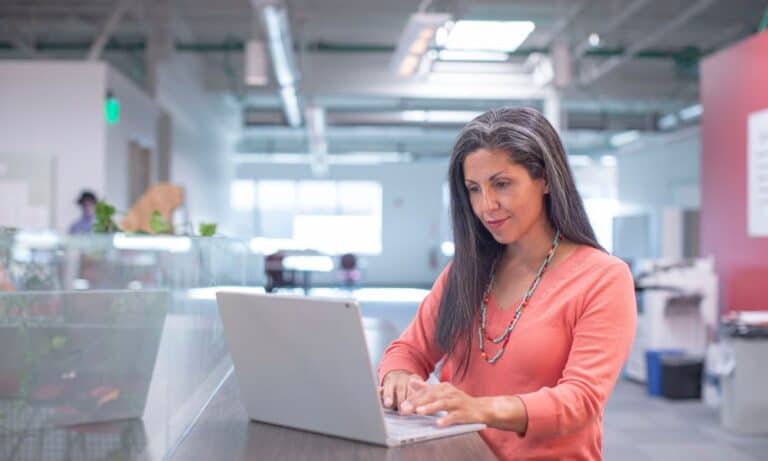 Photo of a social media manager working in an office.