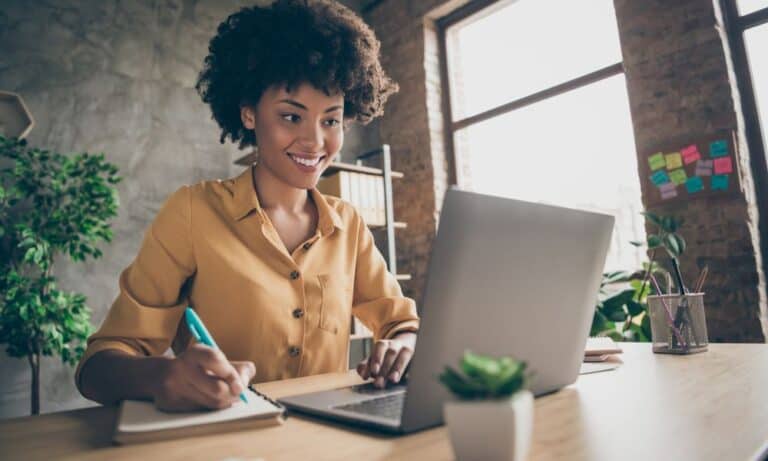 Woman working on laptop at home