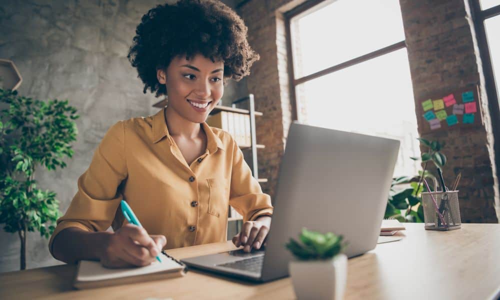 Woman working on laptop at home