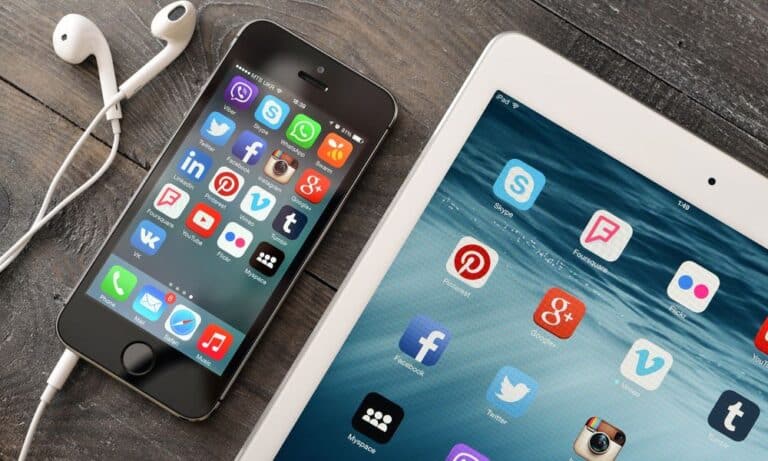 Phone and iPad with social media icons