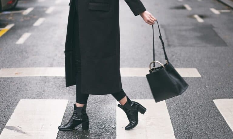 Influencer crossing the street in city