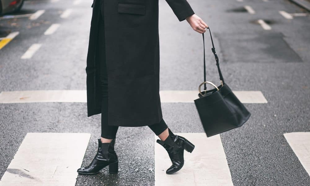 Influencer crossing the street in city