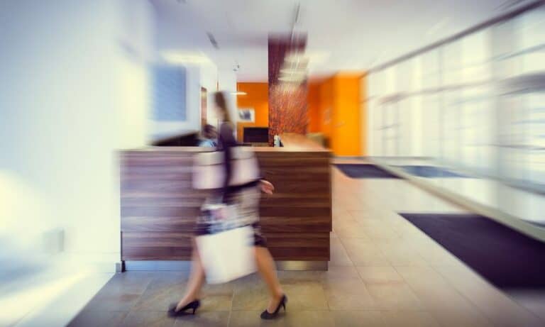 Woman walking through office