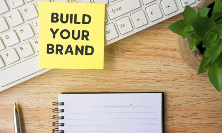 Photo of a Post-It note saying "Build Your Brand".