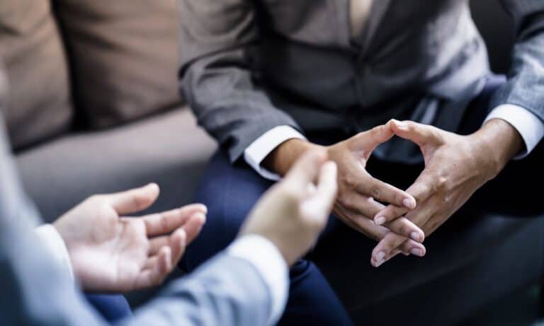 Photo of employee discussing 3% raise with employer.