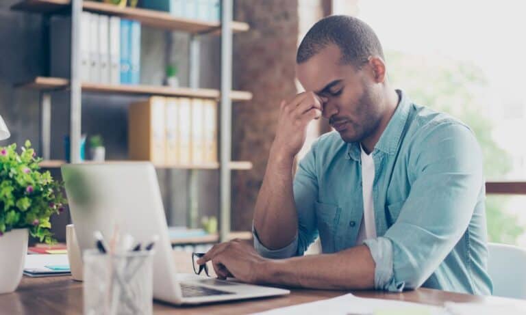 Photo of an employee experiencing burnout.