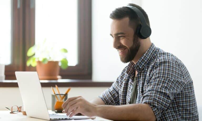 Photo of an employee listening in on a video conference.