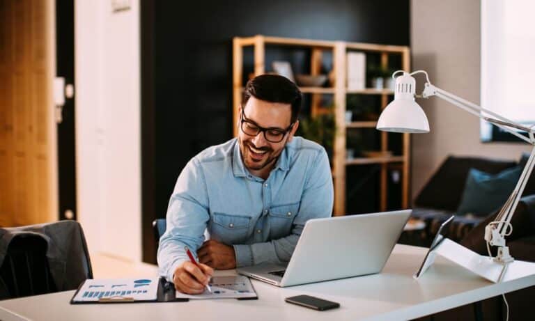 Photo of an employee successfully working from home.