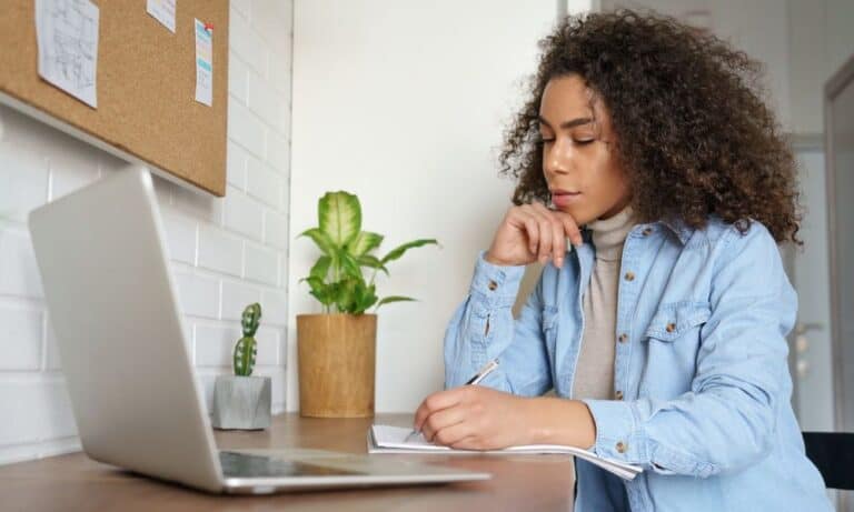 Photo of an employee writing a letter of resignation.