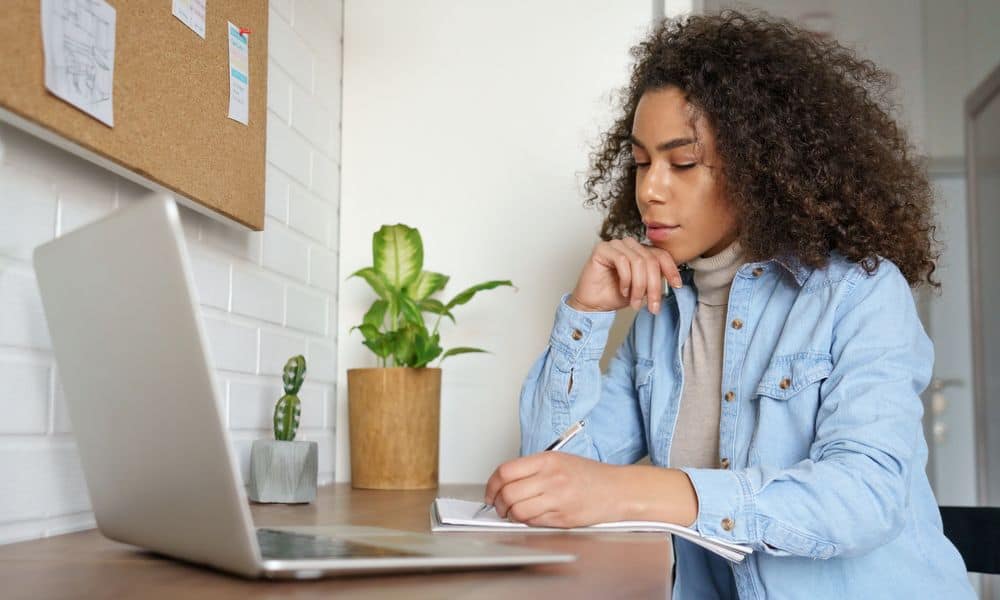 Photo of an employee writing a letter of resignation.
