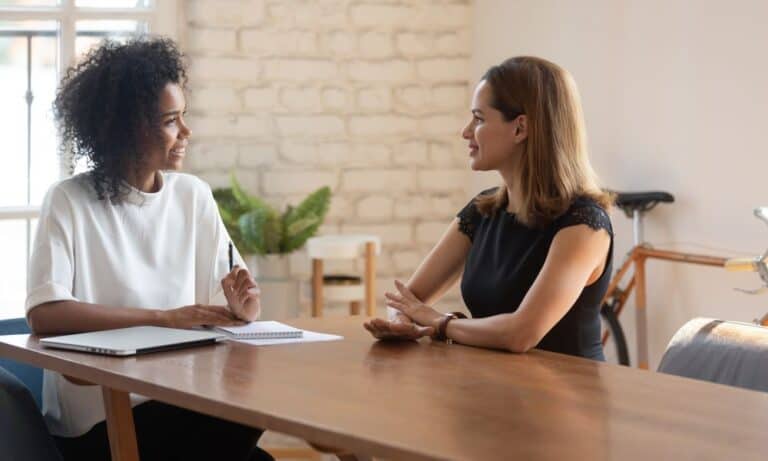 Photo of an employer interviewing for a brand manager.